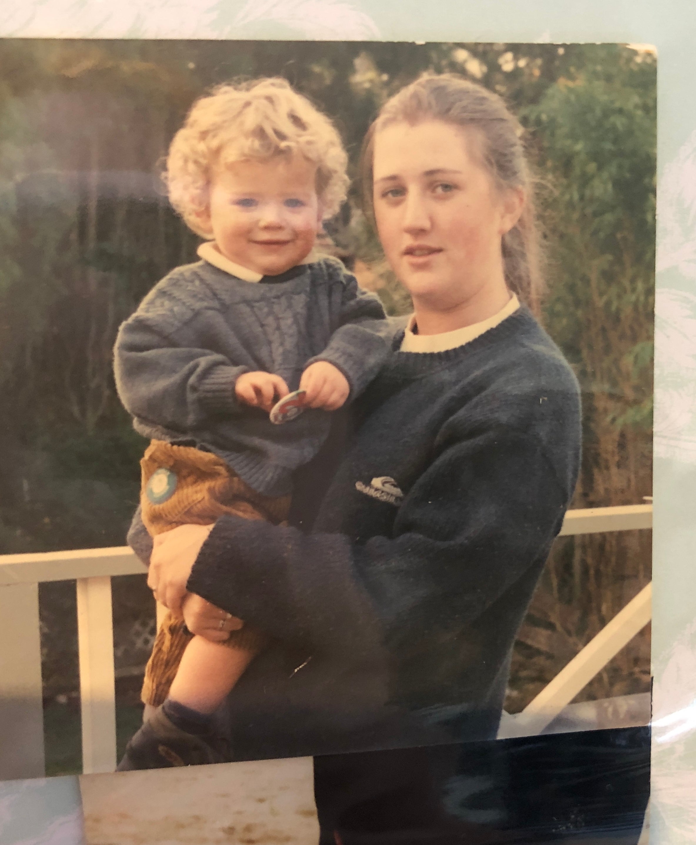 Teenage Sarah holding baby Dan