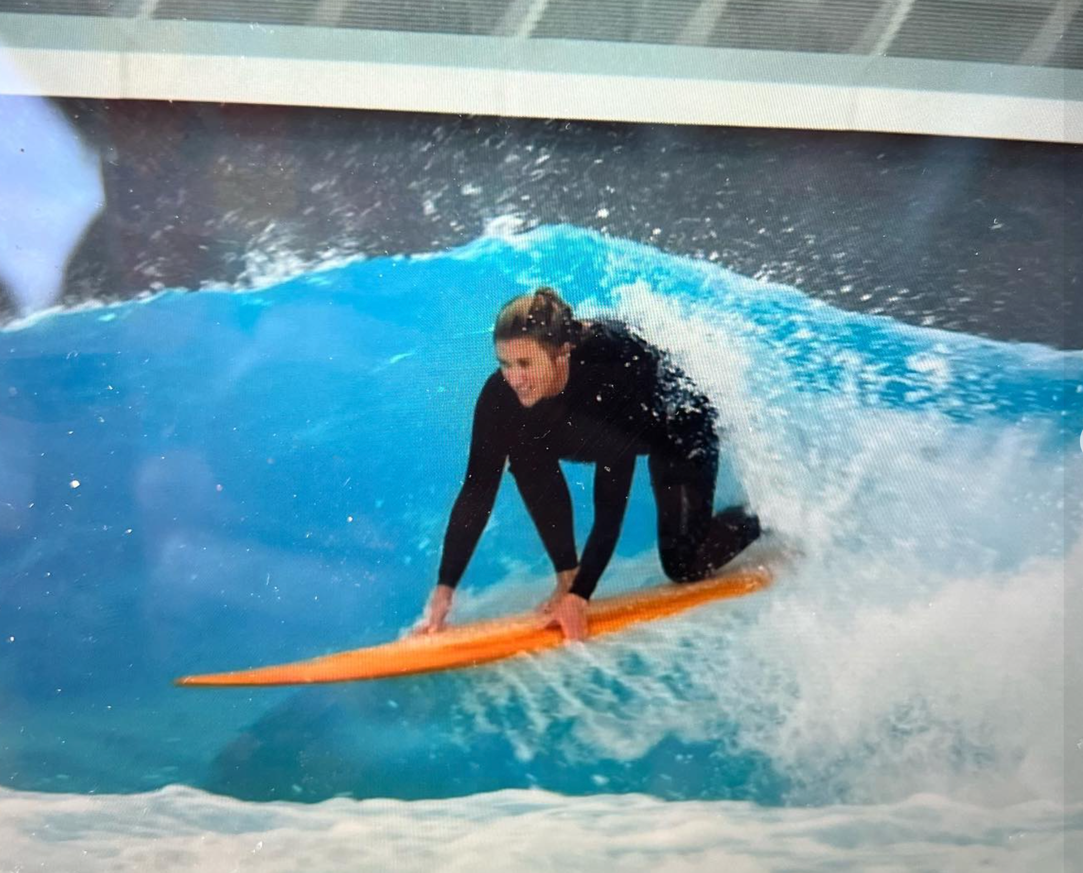 Sarah surfing the wave pool