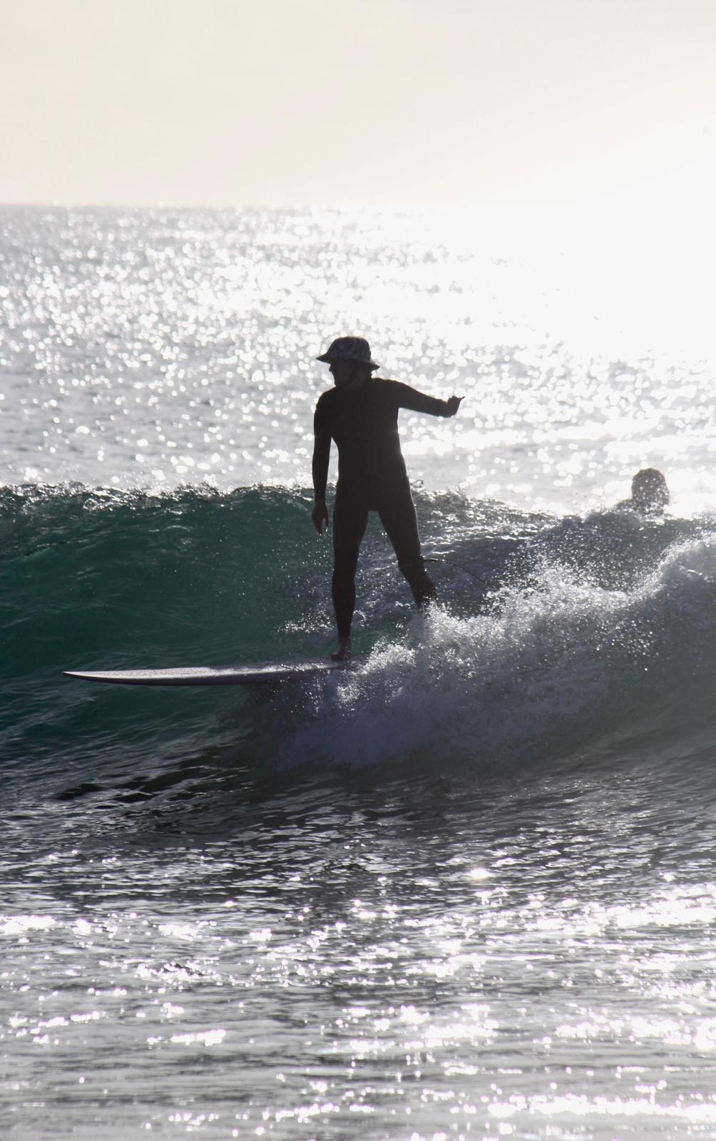 Longboard silhouette at sunset